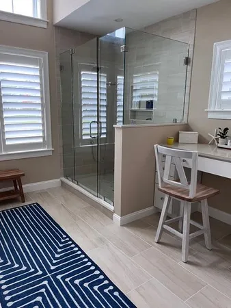 a view of a room with wooden floor and furniture