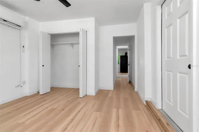 a view of a room with wooden floor