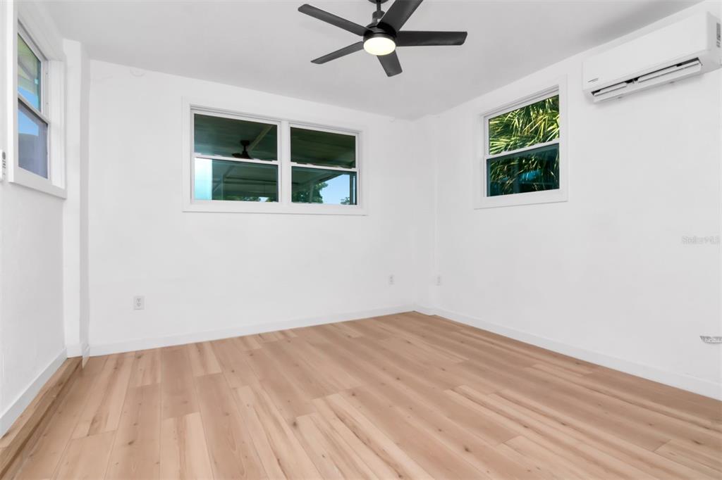 7148 Ramor Lane New Port Richey, FL 34653 - Photo 12 of 26 a view of empty room with window and ceiling fan