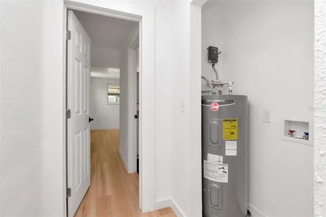 a bathroom with a granite countertop toilet and a sink