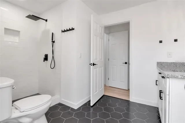 a bathroom with a double vanity sink mirror and