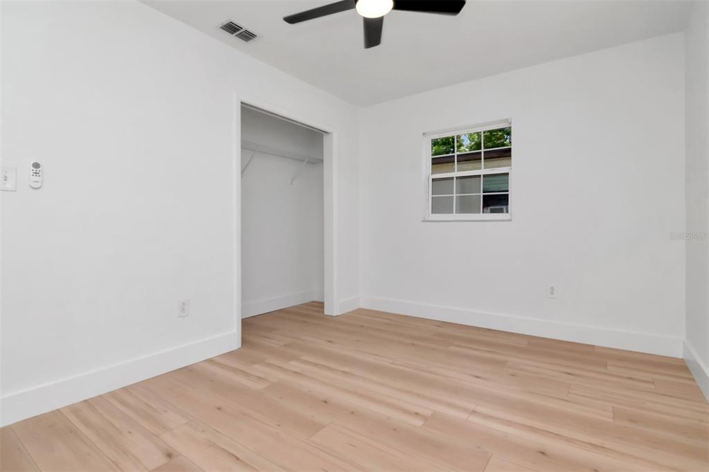 7148 Ramor Lane New Port Richey, FL 34653 - Photo 19 of 26 wooden floor in an empty room