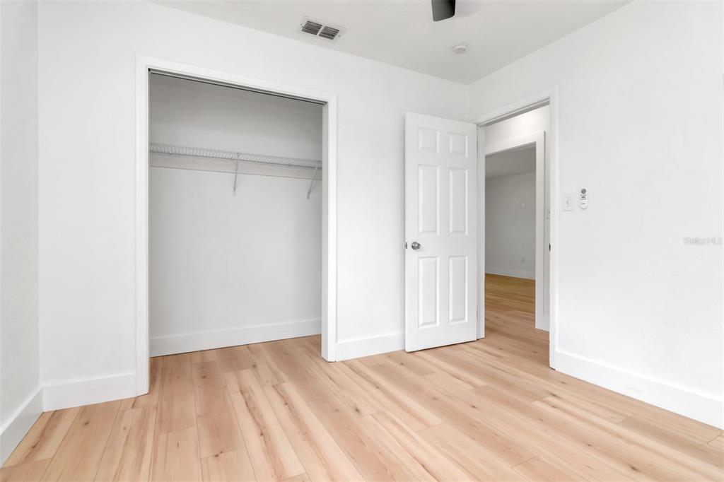 7148 Ramor Lane New Port Richey, FL 34653 - Photo 21 of 26 a view of an empty room with wooden floor