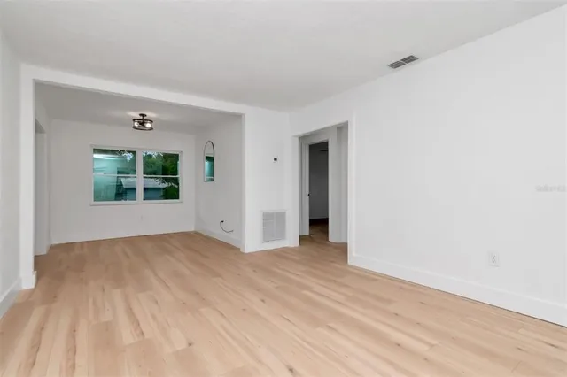 a view of an empty room with a window