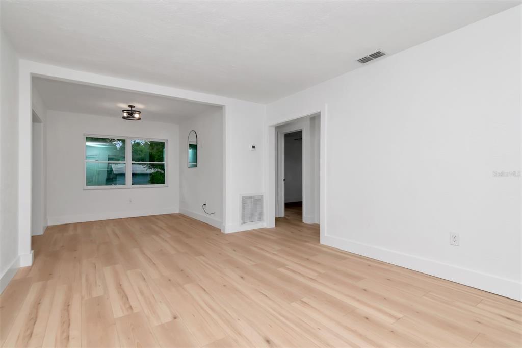 7148 Ramor Lane New Port Richey, FL 34653 - Photo 4 of 26 a view of an empty room with a window