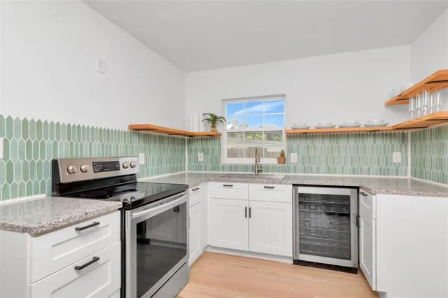 a kitchen with a stove and a sink