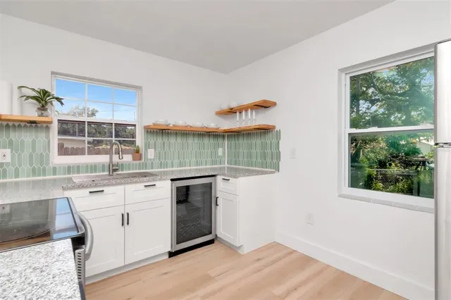 a kitchen with a stove and a sink