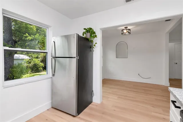 a view of a storage & utility room with a window