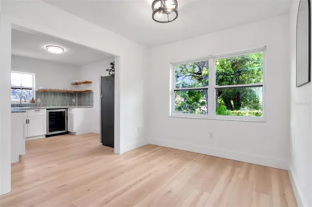a view of a kitchen with a sink dishwasher and a microwave