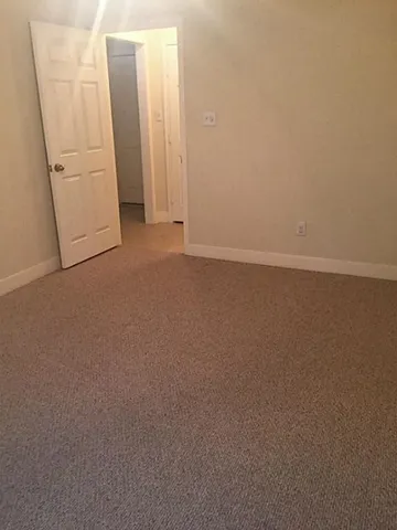 a view of a closet in a bathroom
