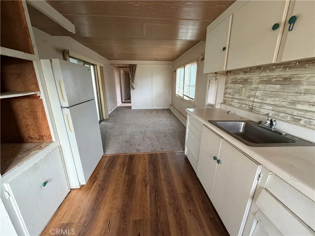 1450 Lake Colusa Ca, Unit 6 Colusa, CA 95932 - Photo 7 of 8 a view of a kitchen with a sink and refrigerator