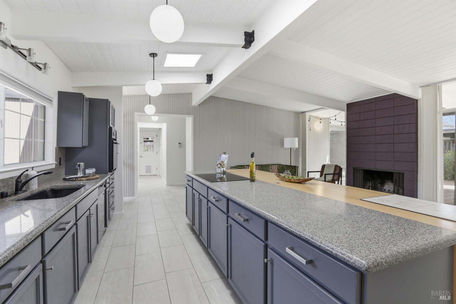 656 Bamboo Terrace San Rafael, CA 94903 - Photo 11 of 26 a kitchen with stainless steel appliances granite countertop a kitchen island a stove and a sink