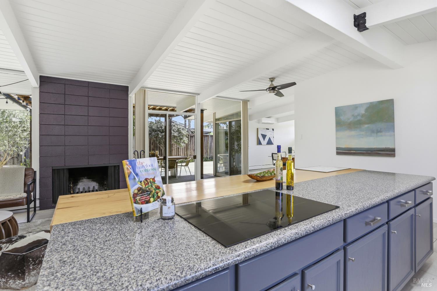 656 Bamboo Terrace San Rafael, CA 94903 - Photo 13 of 26 a kitchen with a granite countertop sink a stove a dining table and chairs