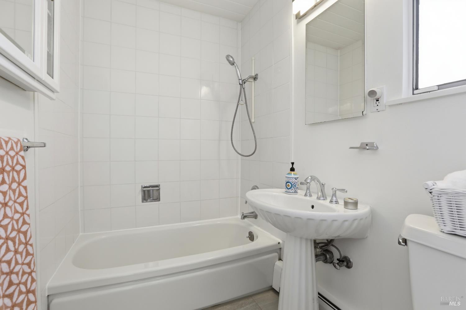 656 Bamboo Terrace San Rafael, CA 94903 - Photo 19 of 26 a bathroom with a sink a bath tub and a shower