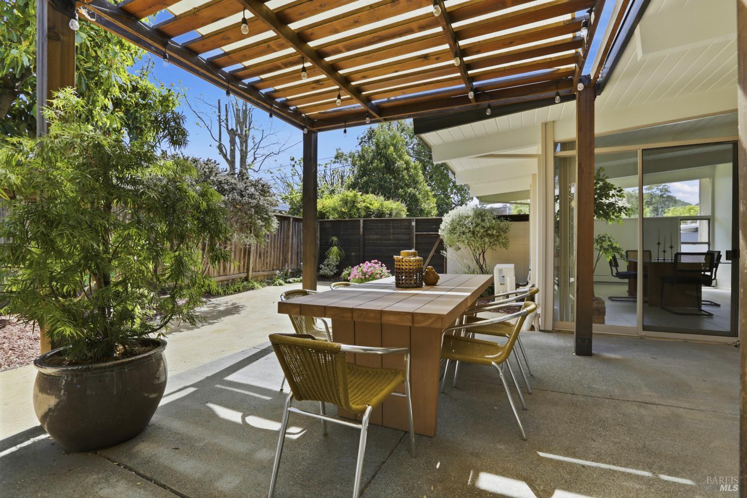 656 Bamboo Terrace San Rafael, CA 94903 - Photo 22 of 26 a view of a patio with table and chairs and potted plants