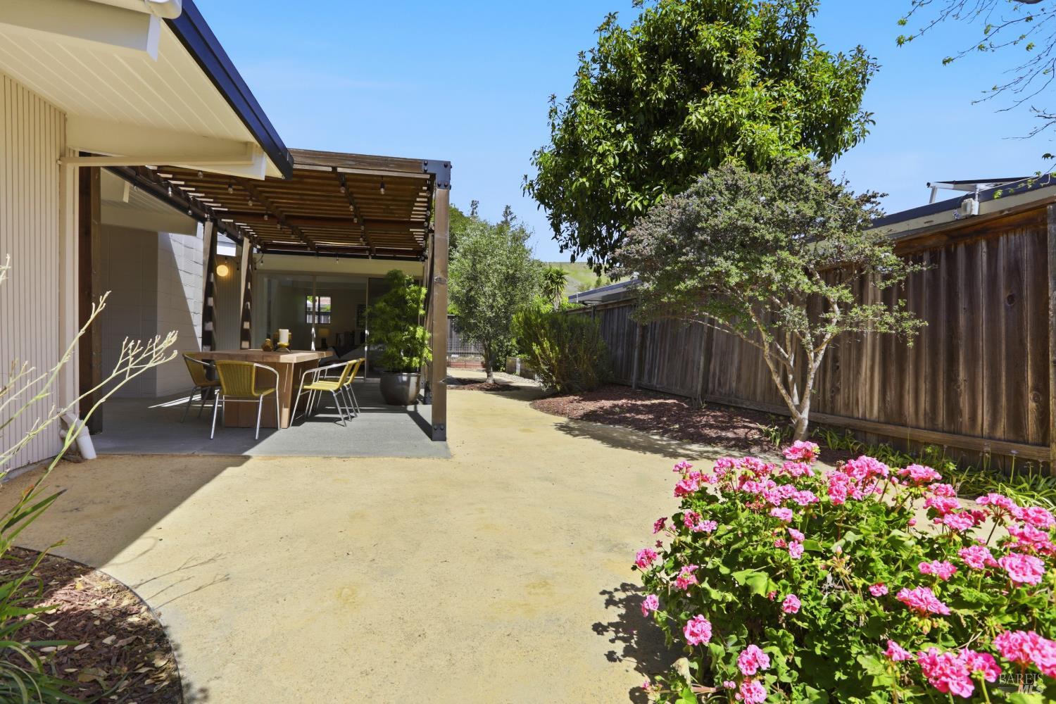 656 Bamboo Terrace San Rafael, CA 94903 - Photo 24 of 26 a view of a patio with table and chairs and potted plants