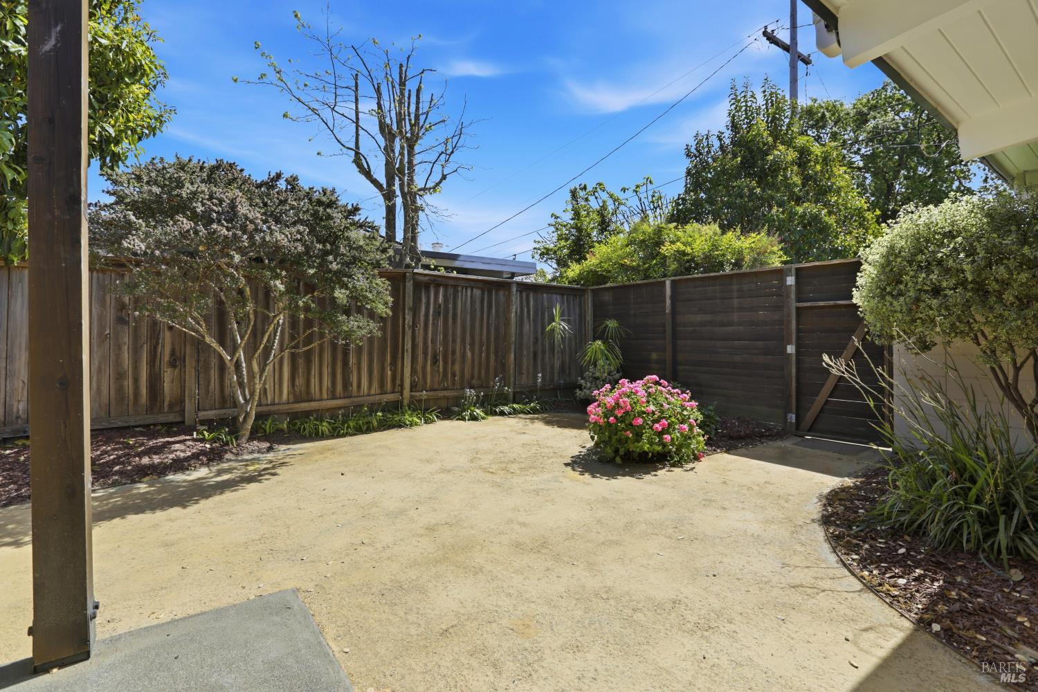 656 Bamboo Terrace San Rafael, CA 94903 - Photo 25 of 26 a wooden bench sitting in front of a house