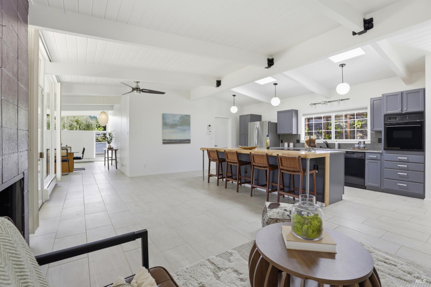 656 Bamboo Terrace San Rafael, CA 94903 - Photo 8 of 26 a living room with lots of furniture and kitchen view
