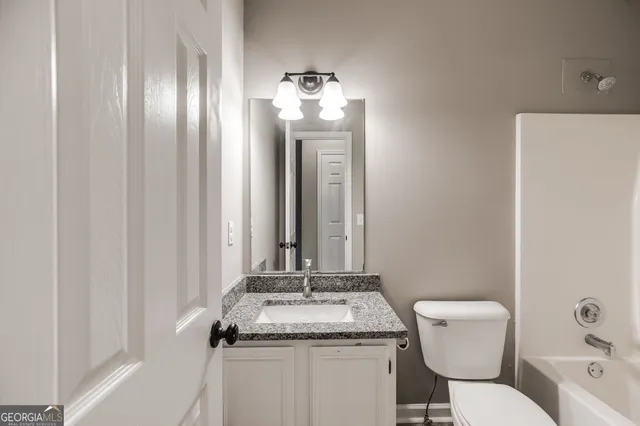 a bathroom with a toilet and a sink