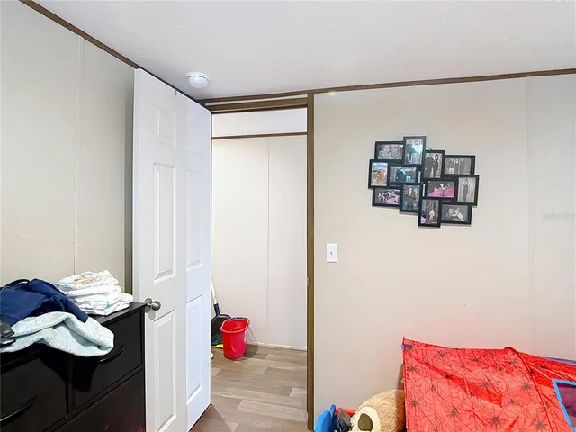 a bedroom with a bed and closet