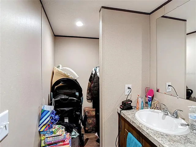 a bathroom with a sink and a mirror