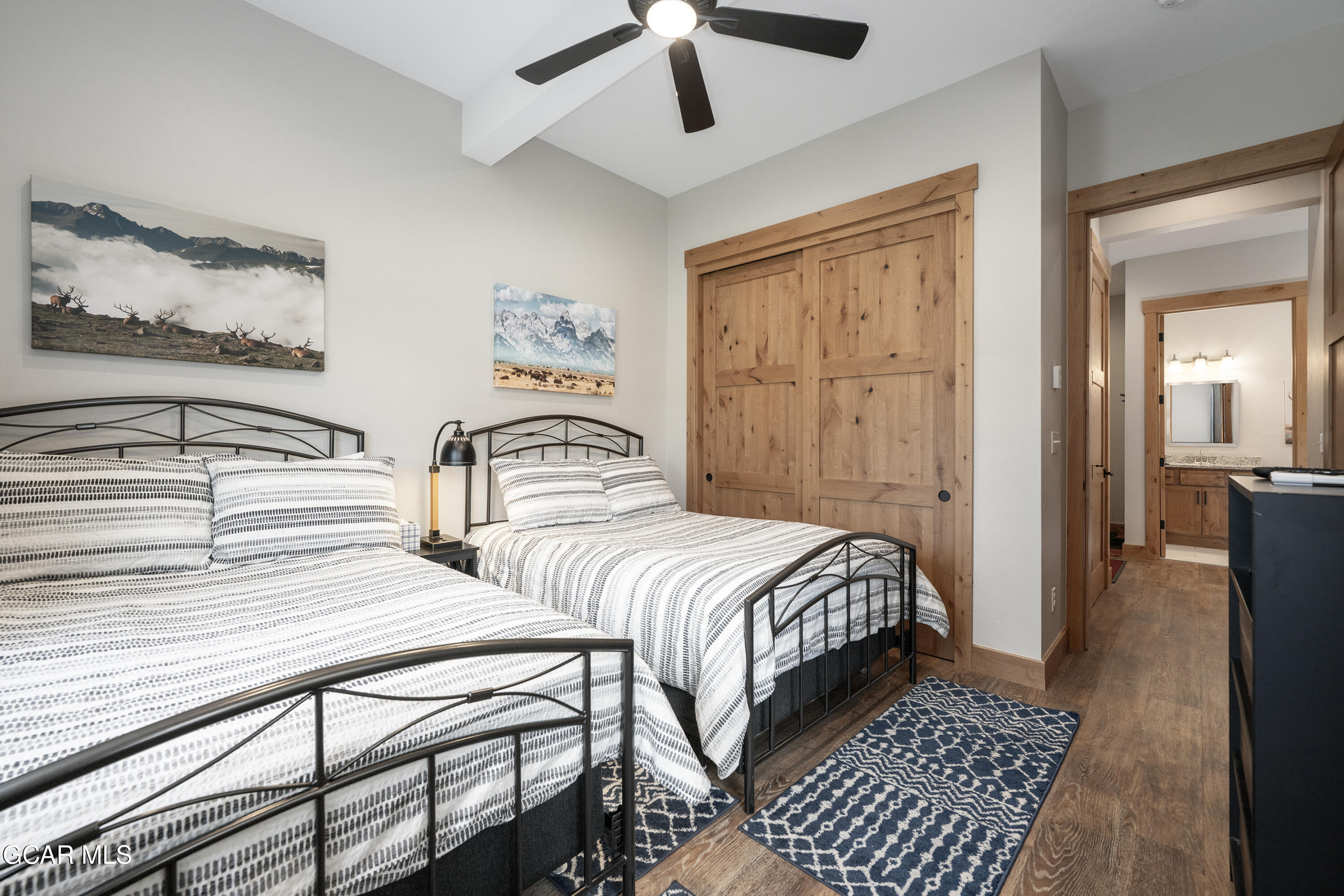 40 Springview Lane Fraser, CO 80442 - Photo 10 of 36 a bedroom with two beds and painting on the wall