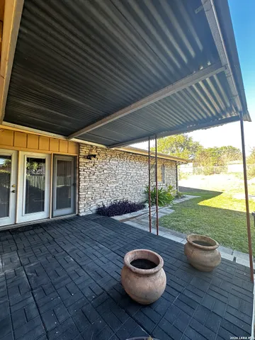 a view of a backyard of the house