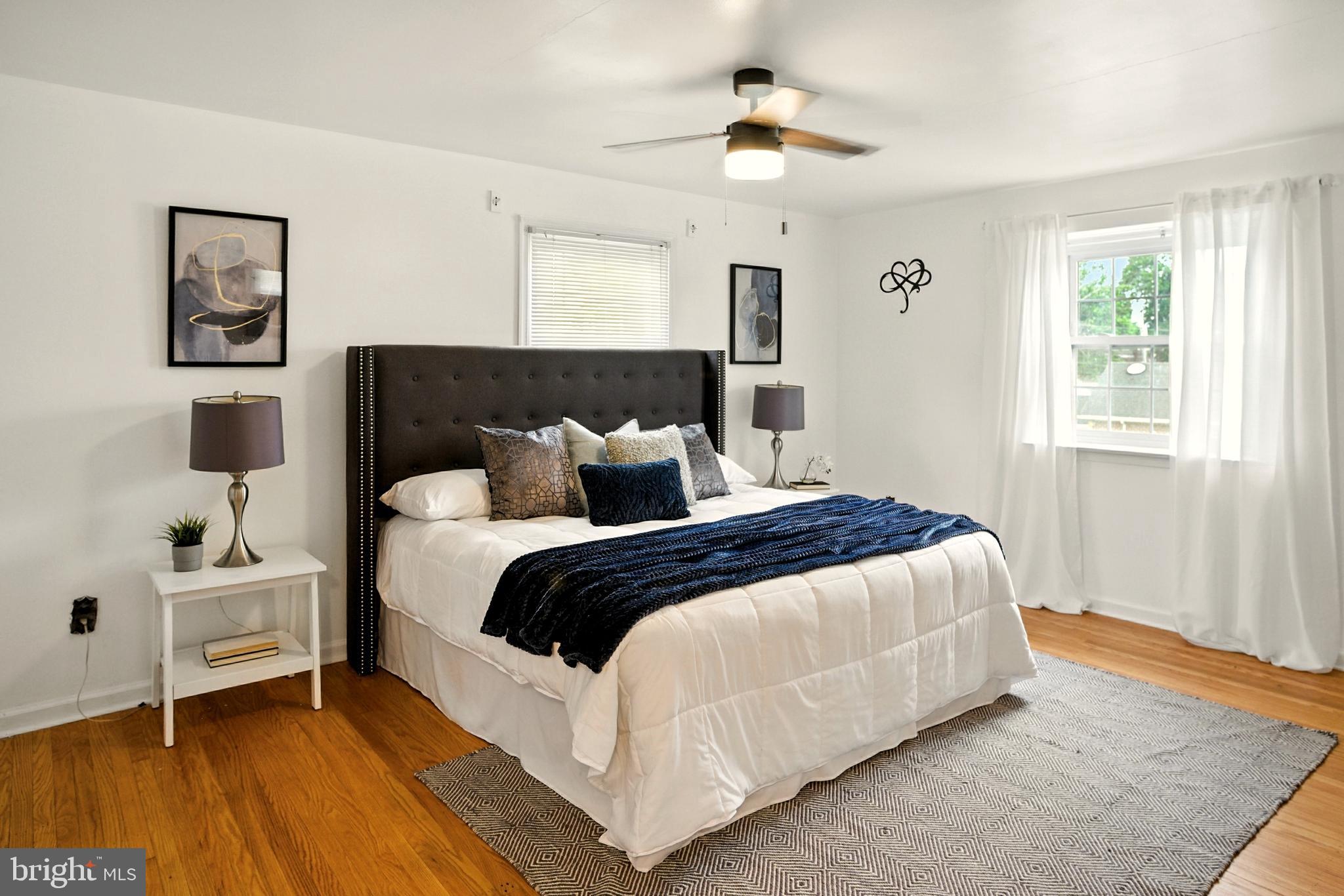 364 South Rolling Road Springfield, PA 19064 - Photo 19 of 37 a bedroom with bed and a chandelier