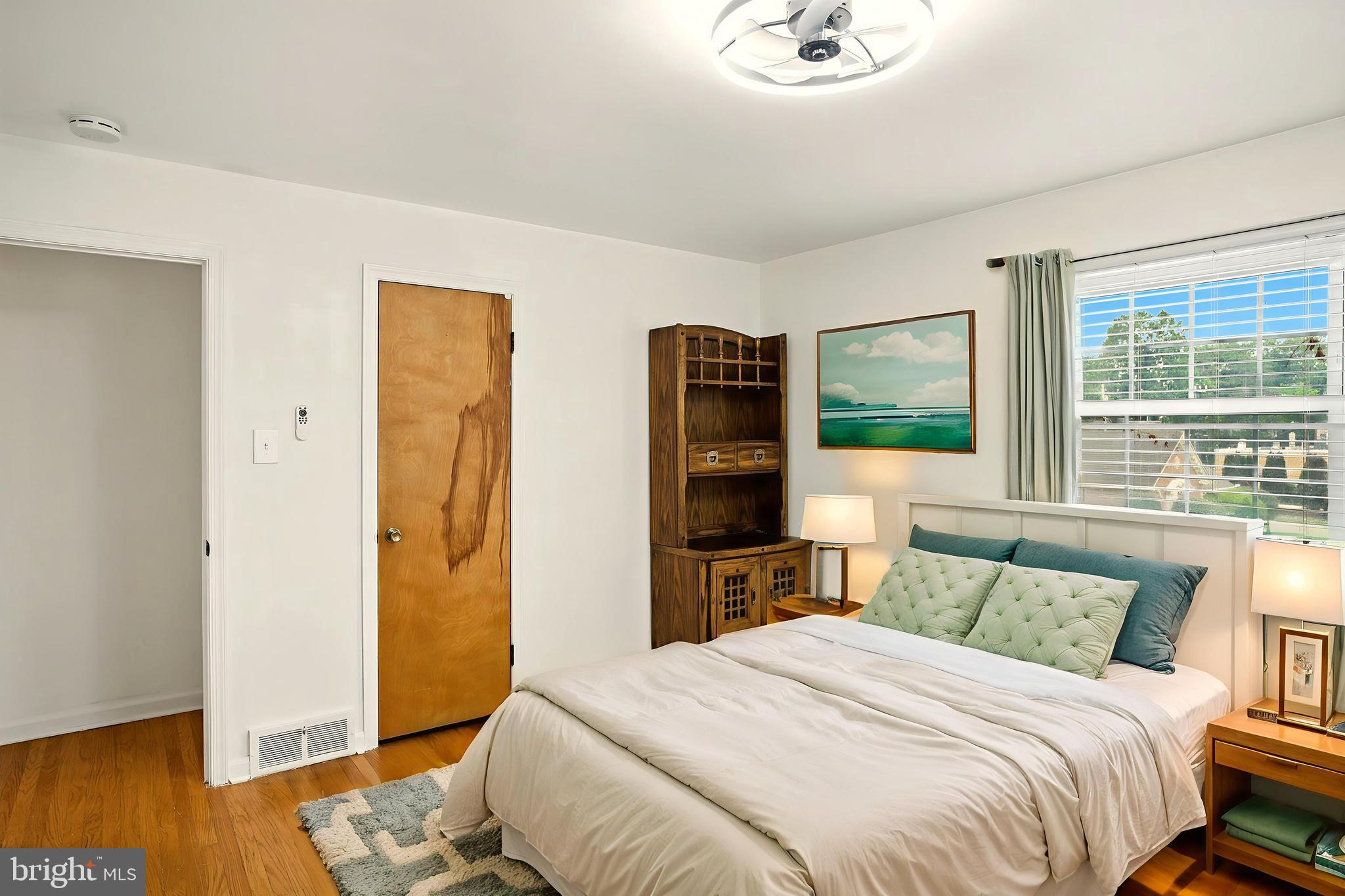 364 South Rolling Road Springfield, PA 19064 - Photo 24 of 37 a bedroom with a bed and wooden floor