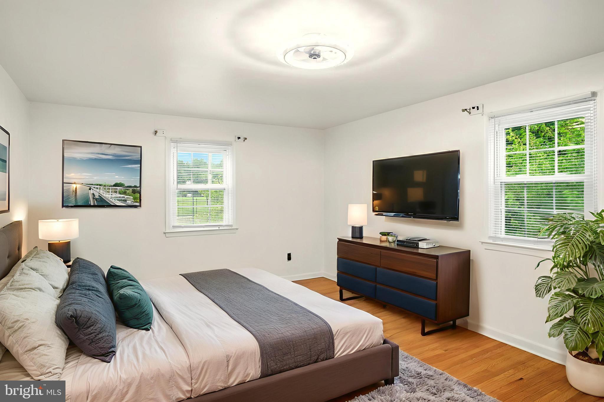 364 South Rolling Road Springfield, PA 19064 - Photo 26 of 37 a bedroom with a bed and a flat screen tv