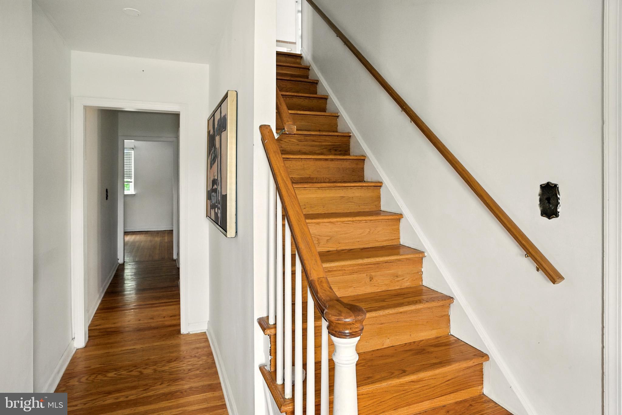 364 South Rolling Road Springfield, PA 19064 - Photo 3 of 37 a view of staircase with wooden floor and white walls