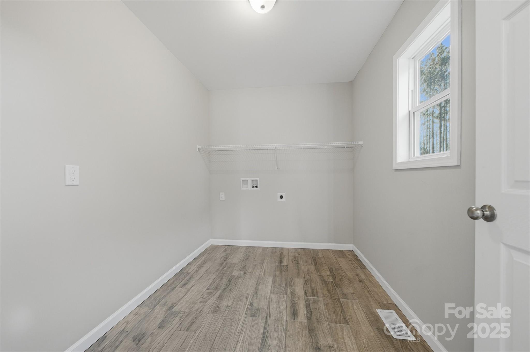 4951 Grace Chapel Road Granite Falls, NC 28630 - Photo 15 of 38 a view of a room with wooden floor and windows