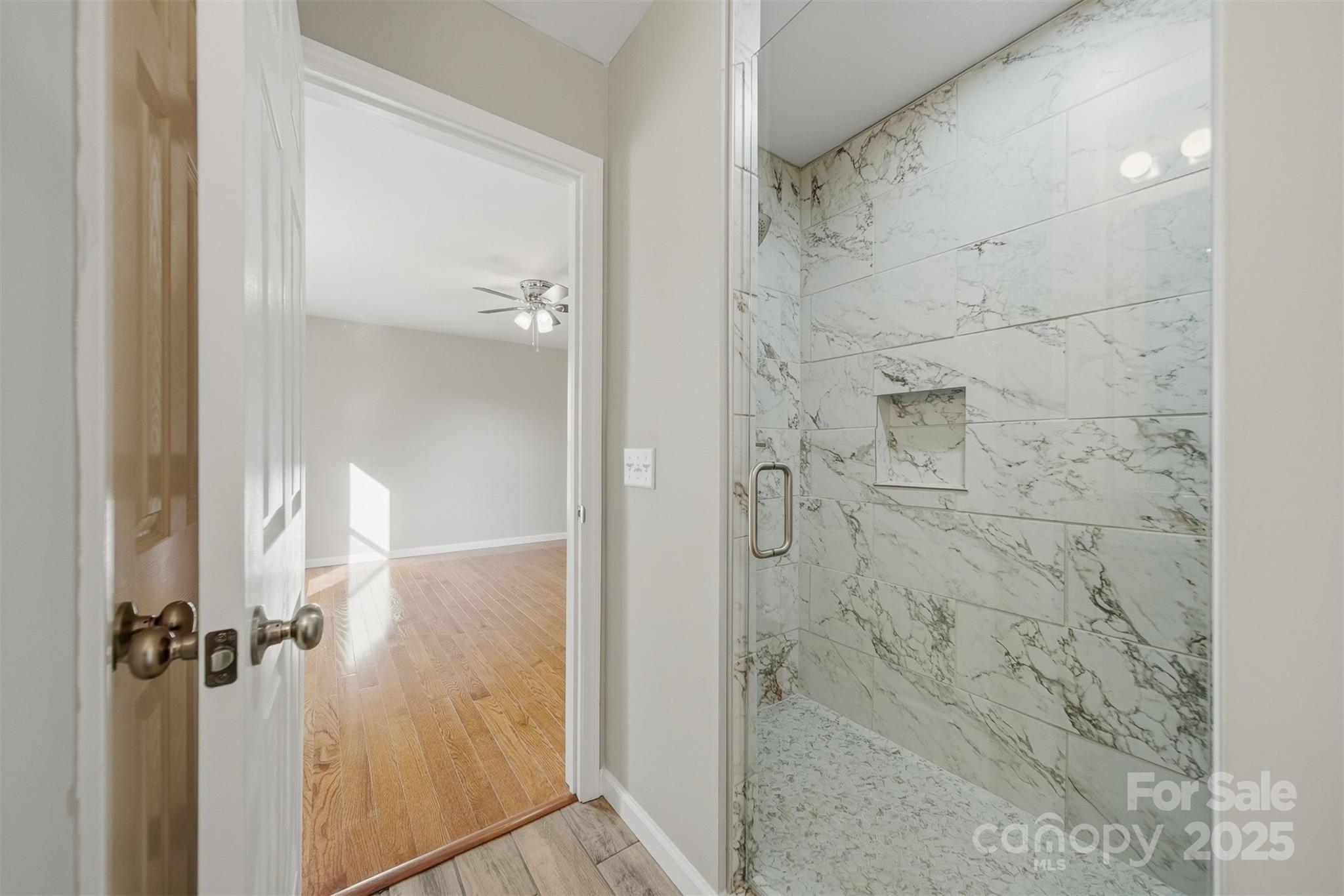 4951 Grace Chapel Road Granite Falls, NC 28630 - Photo 20 of 38 a bathroom with a glass shower door