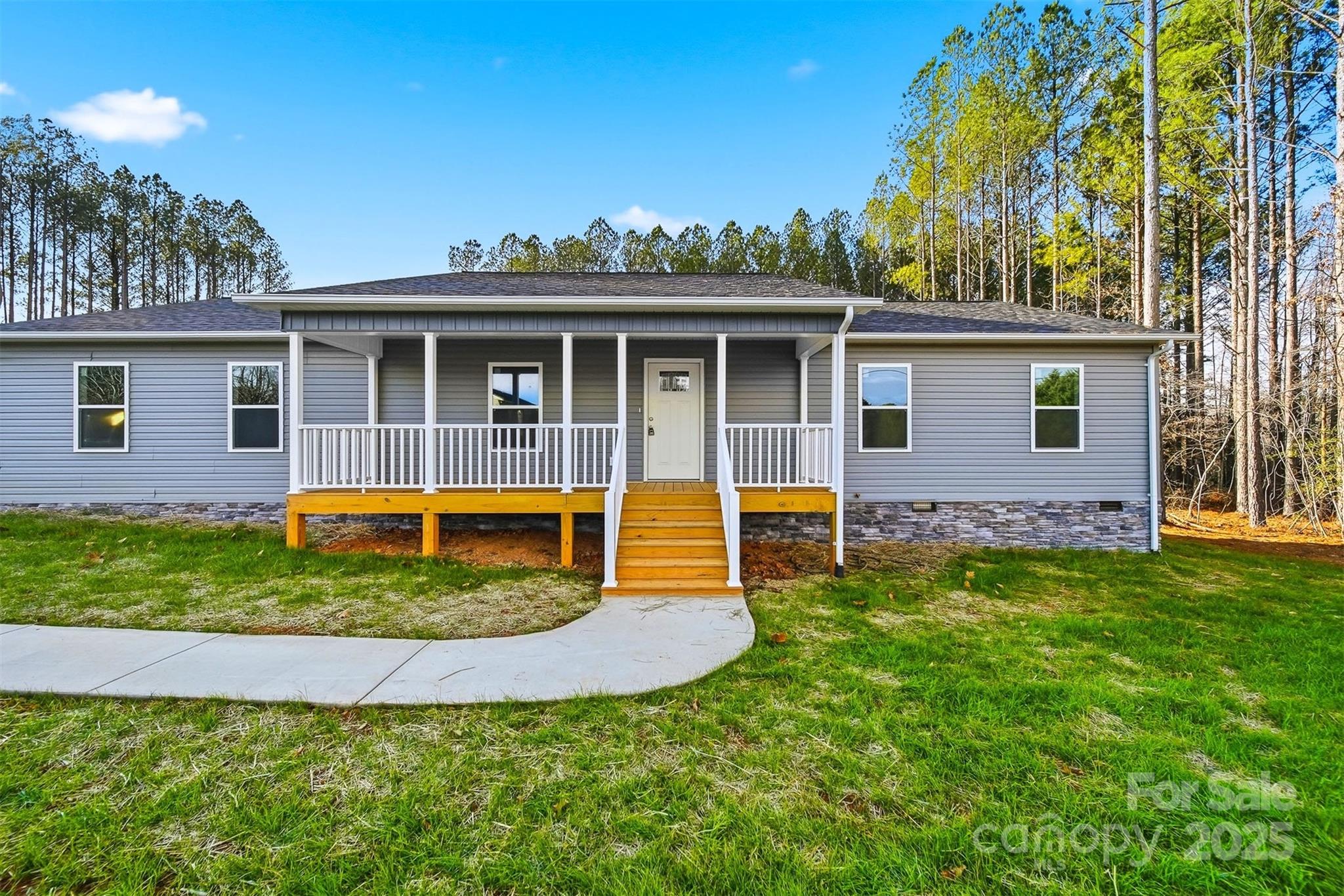 4951 Grace Chapel Road Granite Falls, NC 28630 - Photo 2 of 38 a view of a house with pool and a small yard