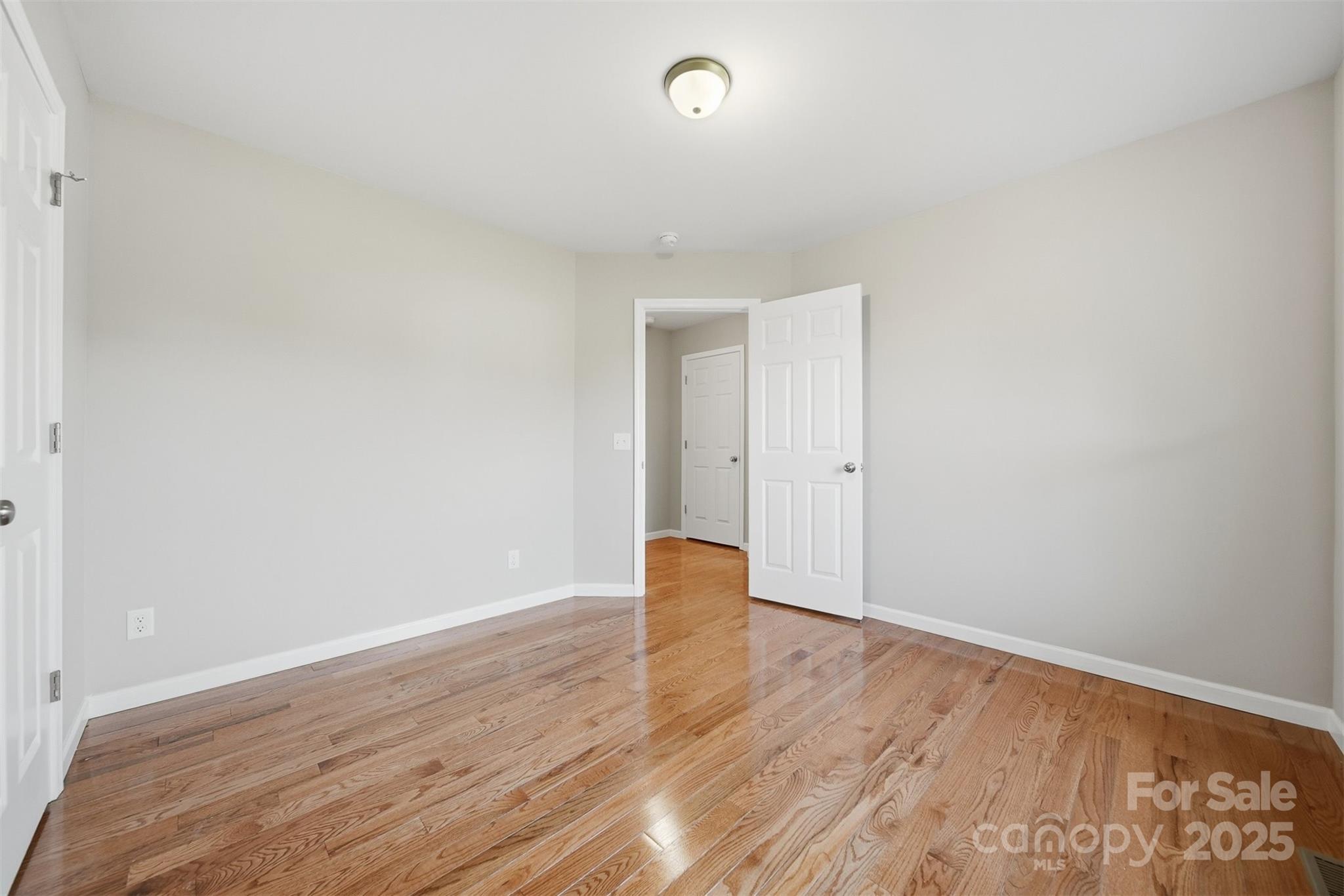 4951 Grace Chapel Road Granite Falls, NC 28630 - Photo 26 of 38 a view of an empty room with wooden floor