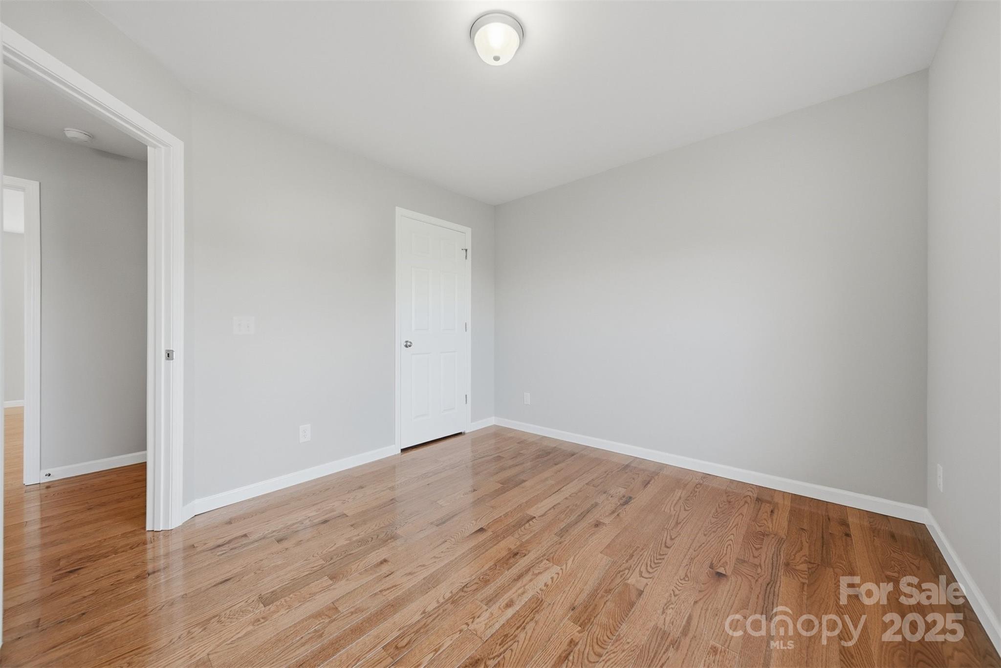 4951 Grace Chapel Road Granite Falls, NC 28630 - Photo 28 of 38 a view of an empty room and wooden floor