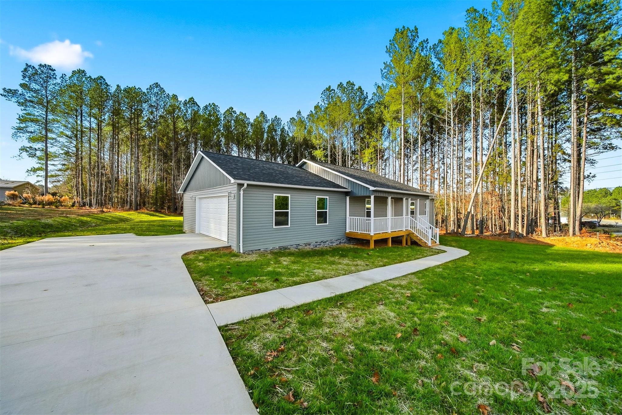 4951 Grace Chapel Road Granite Falls, NC 28630 - Photo 3 of 38 a view of house with backyard and trees