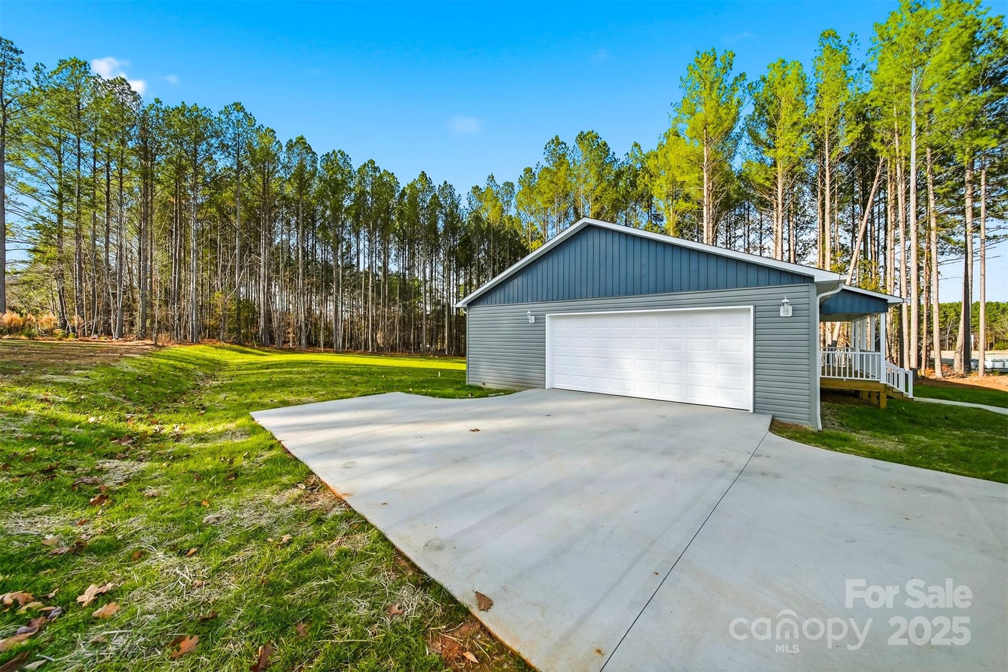 4951 Grace Chapel Road Granite Falls, NC 28630 - Photo 32 of 38 a front view of a house with a yard and garage