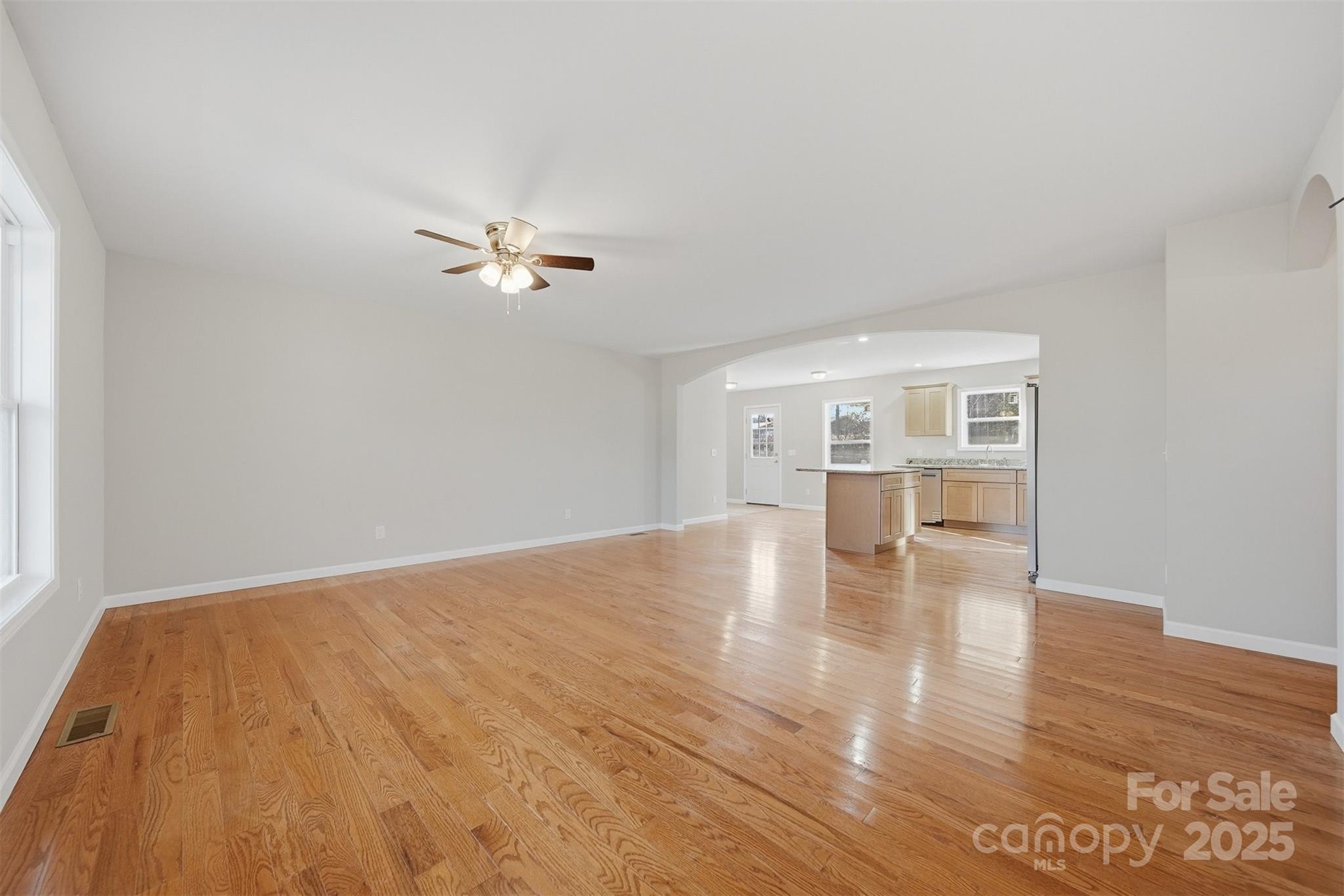 4951 Grace Chapel Road Granite Falls, NC 28630 - Photo 7 of 38 wooden floor in an empty room with a window