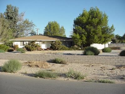 15001 Tuscola Road Apple Valley, CA 92307 - Photo 1 of 1 a view of house with a yard