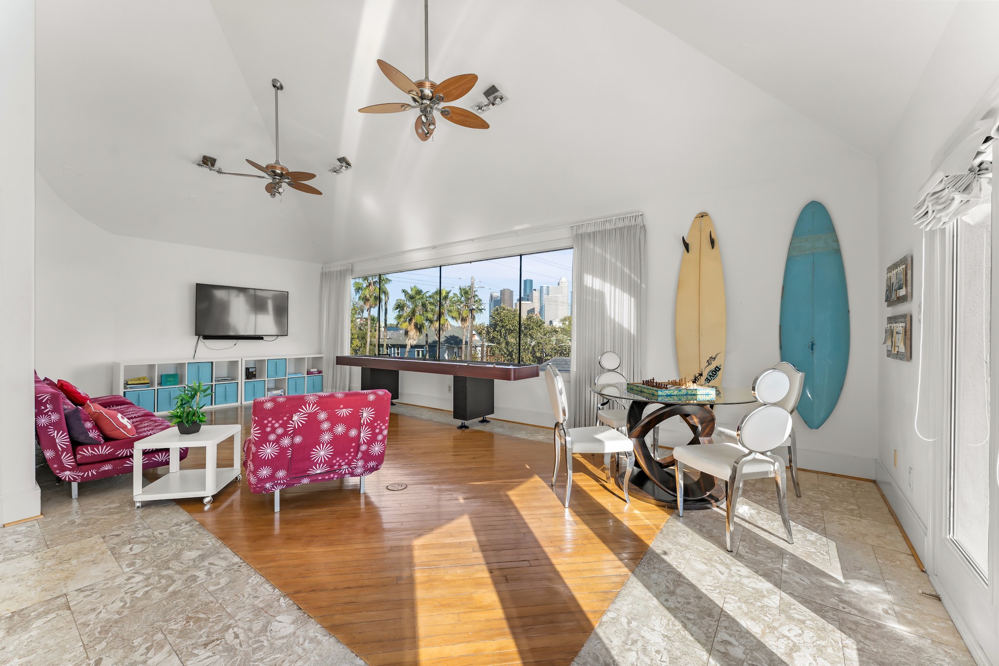 315 Fairview Street, Unit A Houston, TX 77006 - Photo 12 of 35 a living room with furniture a rug and a floor to ceiling window