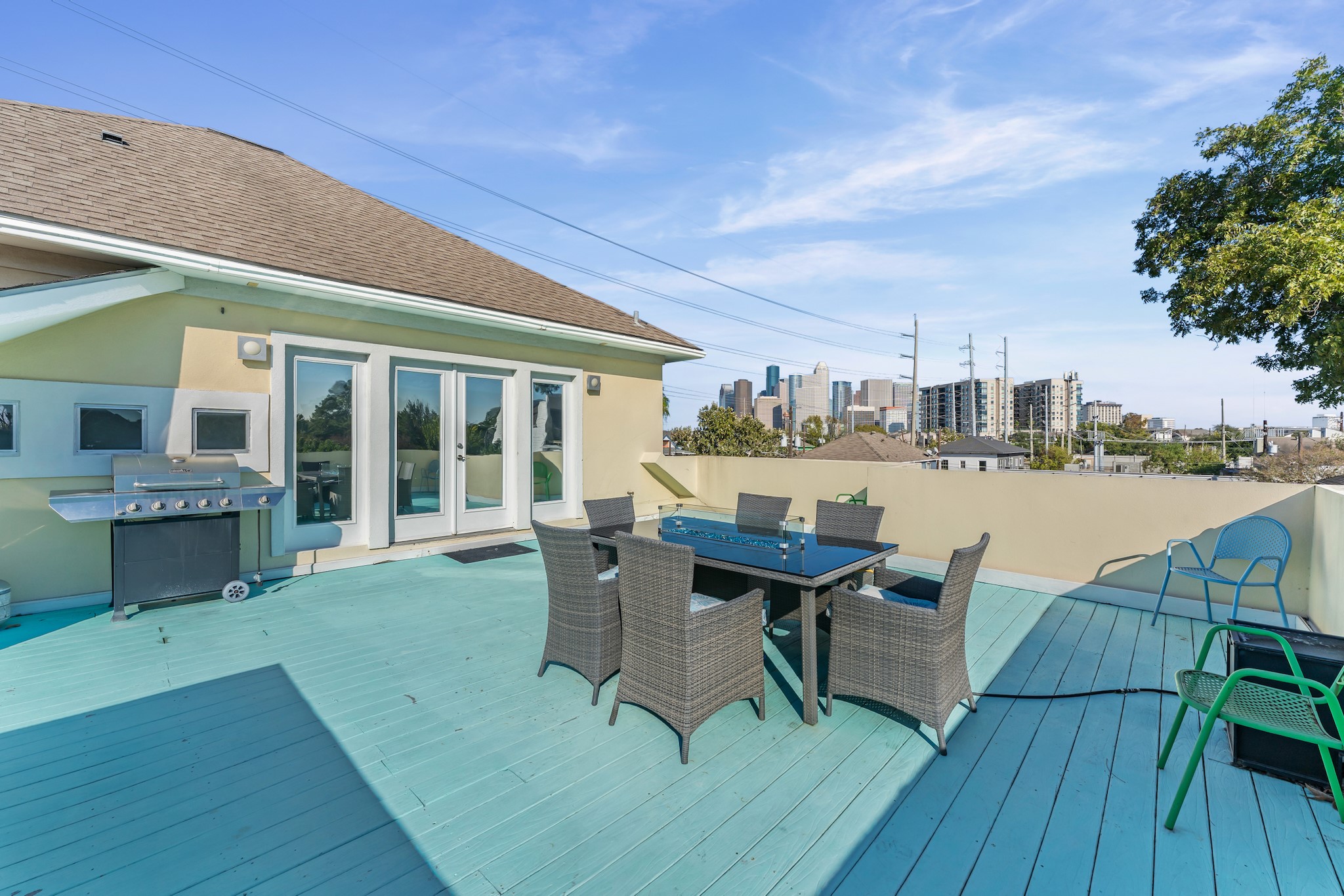 315 Fairview Street, Unit A Houston, TX 77006 - Photo 16 of 35 a view of a patio with table and chairs floor to ceiling window with wooden floor