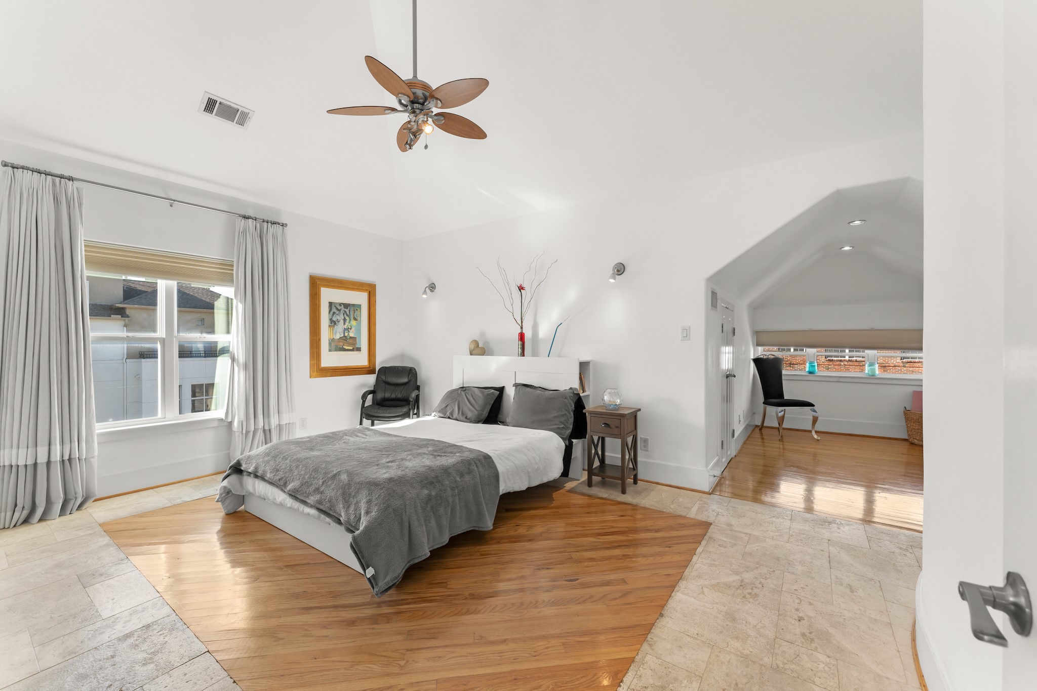 315 Fairview Street, Unit A Houston, TX 77006 - Photo 18 of 35 a bedroom with a bed and wooden floor