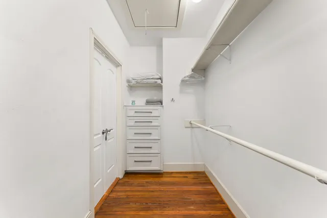 a view of entryway with stairs and wooden floor