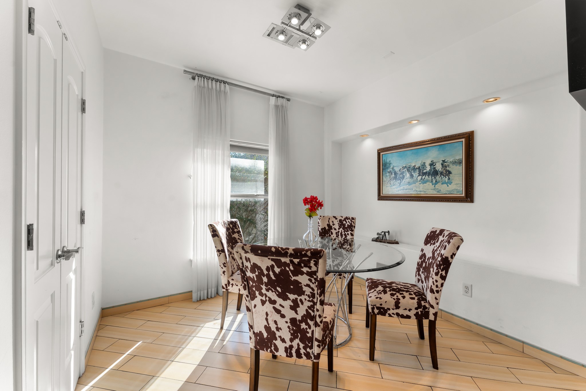 315 Fairview Street, Unit A Houston, TX 77006 - Photo 9 of 35 a view of a dining room with furniture and a chandelier