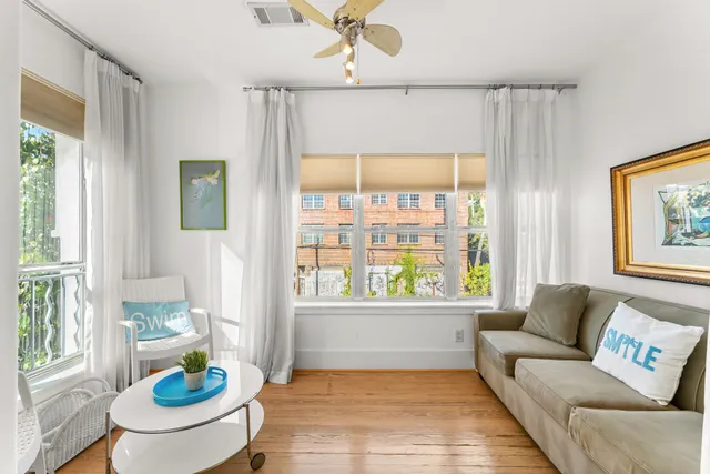 a living room with furniture and a table