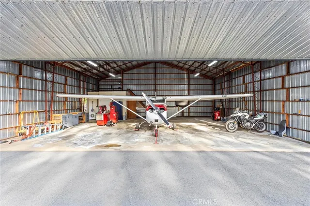 a view of parking garage with cars