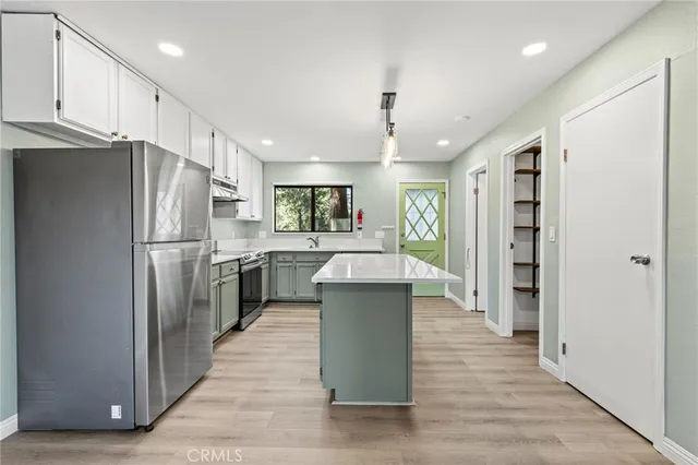 a kitchen with a sink and large window
