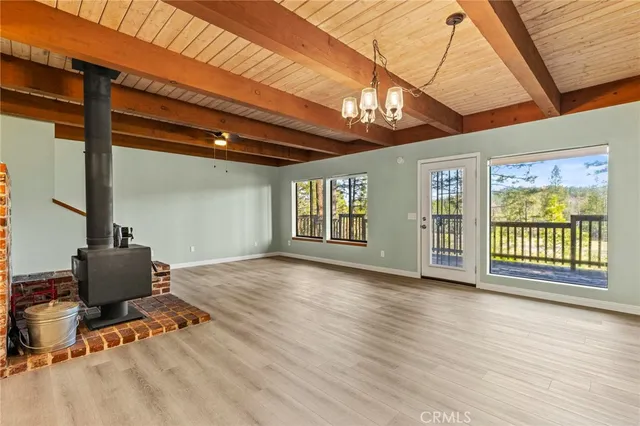 a outdoor dining space with furniture and wooden floor