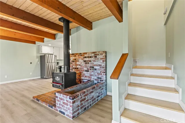 a view of a livingroom with a ceiling fan and a fan